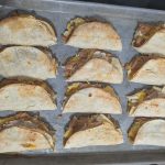 chicken tacos on a baking sheet