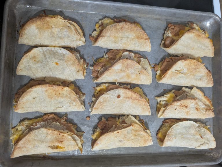 chicken tacos on a baking sheet