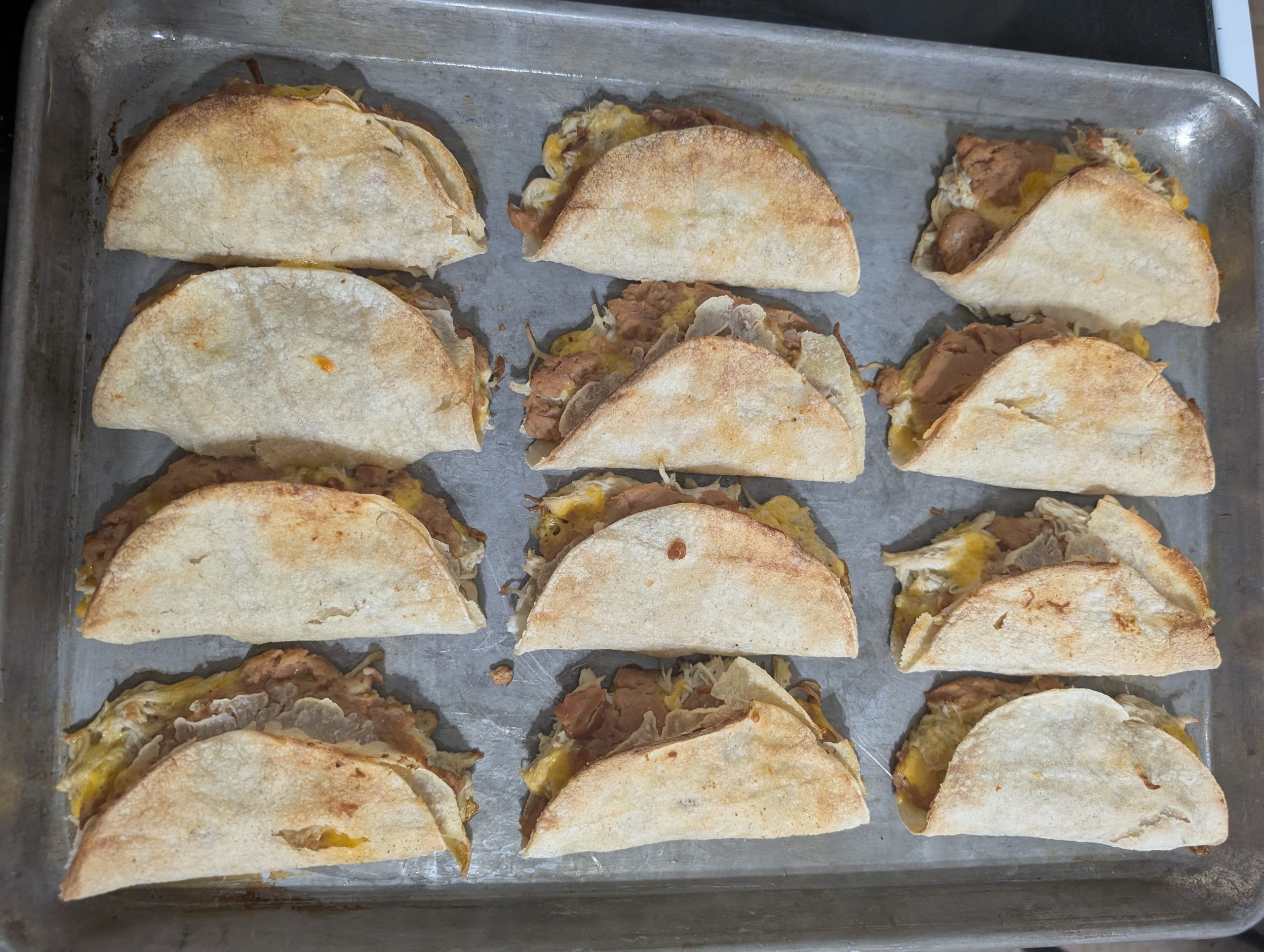 chicken tacos on a baking sheet